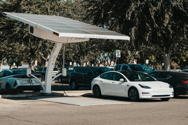 Electric vehicle charging at a public charging station, illustrating the cost of EV in Singapore and everyday charging expenses.