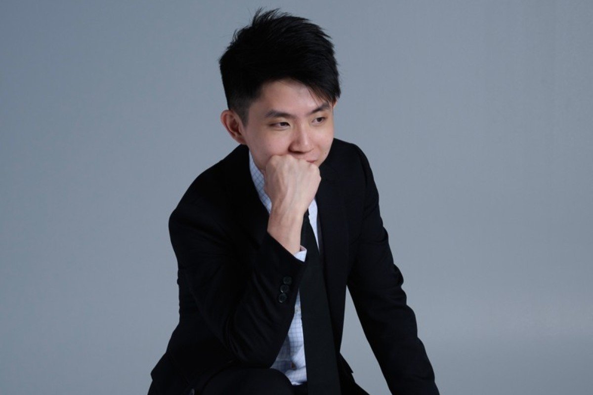 Portrait of a finance content creator in business attire, reflecting on investing and financial planning.
