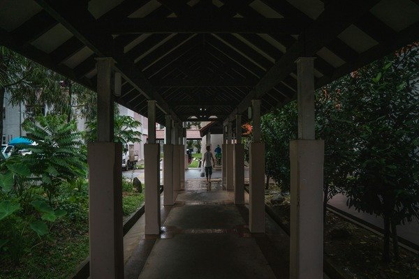 A person walking in a dark hallway