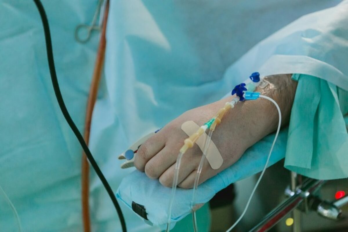 Patient receiving intravenous treatment in hospital, highlighting how MediShield Life changes may affect medical costs.
