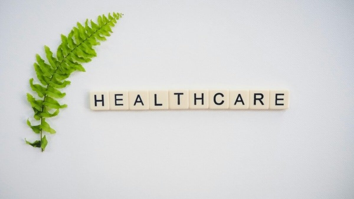 Healthcare lettering beside a green leaf, illustrating MediShield Life changes and long-term medical protection.