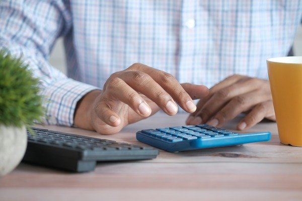 A person using calculators