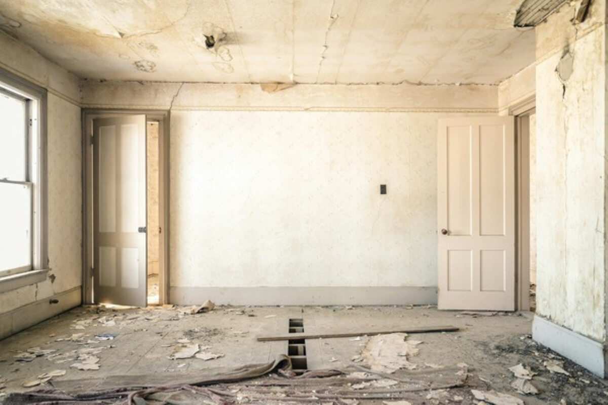 Old, damaged room awaiting repairs, illustrating hidden structural issues that can increase renovation costs in Singapore.