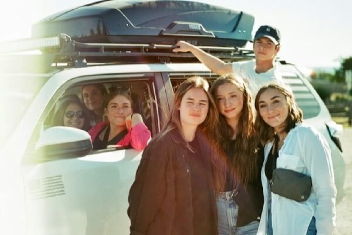 Friends preparing for a road trip as part of a retirement planning lifestyle break.