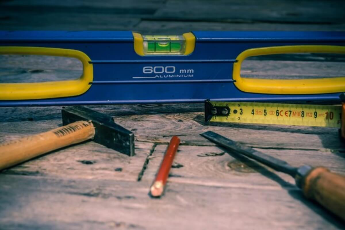Measuring tools on a workbench symbolising planning, precision, and disciplined money management.
