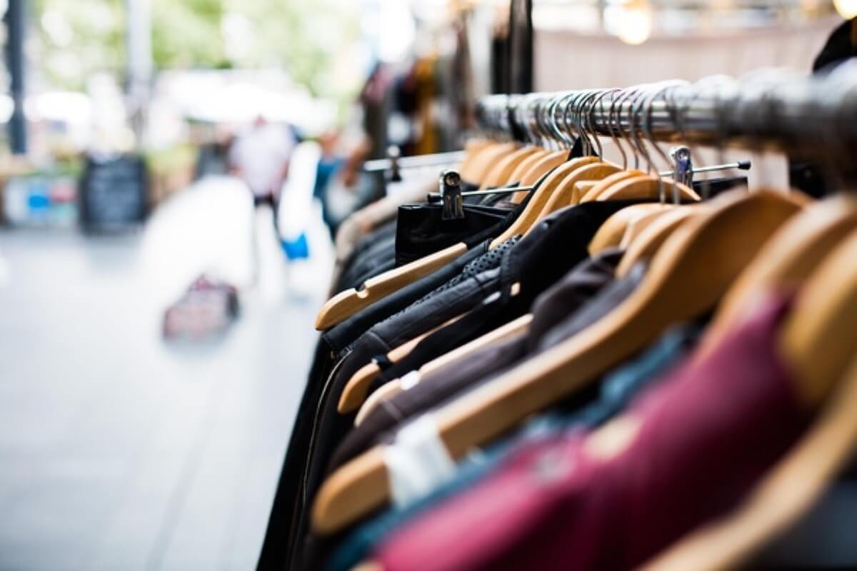 Clothing displayed in a retail shop, illustrating how trump tariff can affect imported goods and consumer prices.