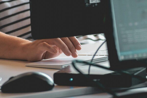 A close-up photo of a person using computer
