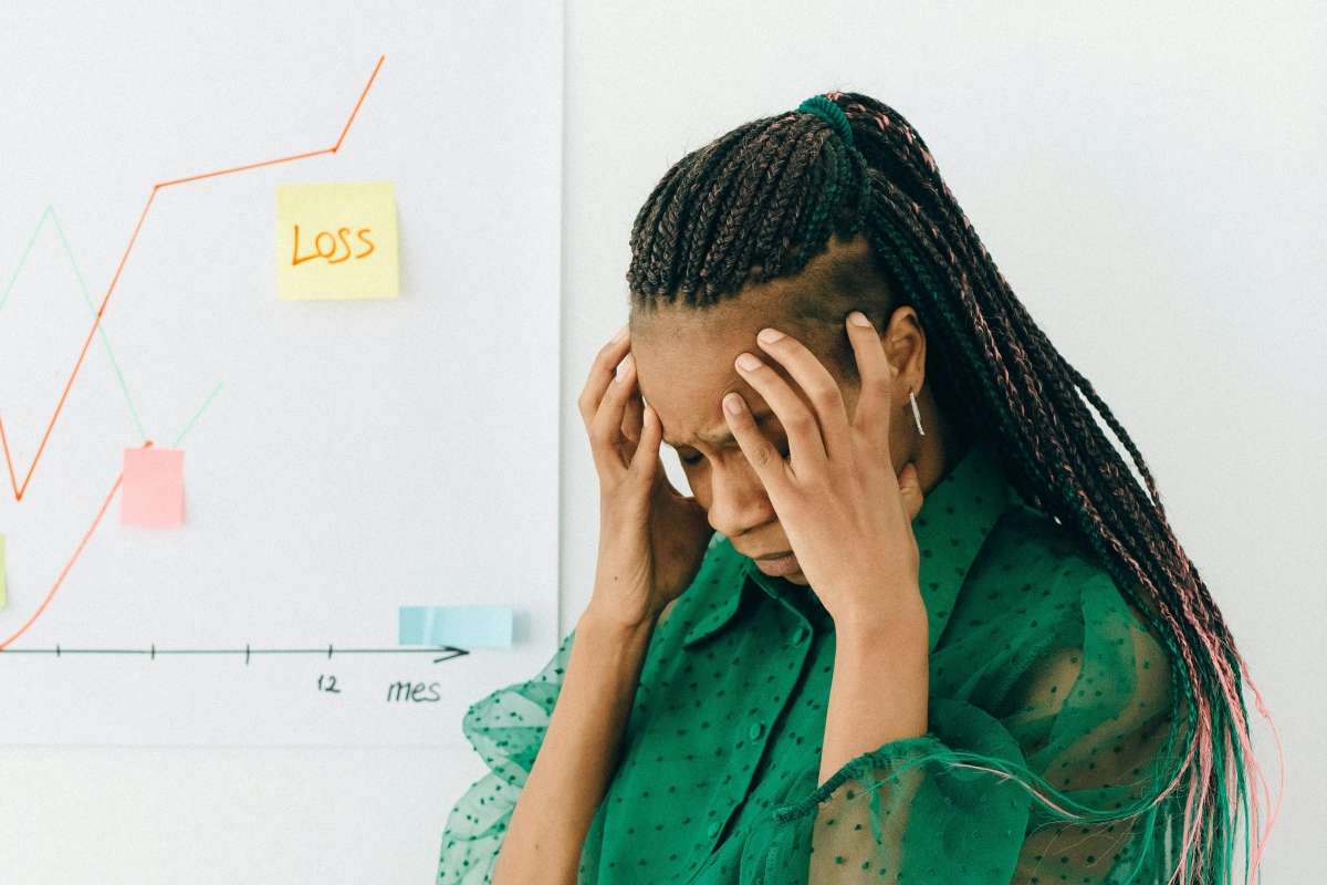 Investor feeling stressed by market losses while considering safer money market funds.