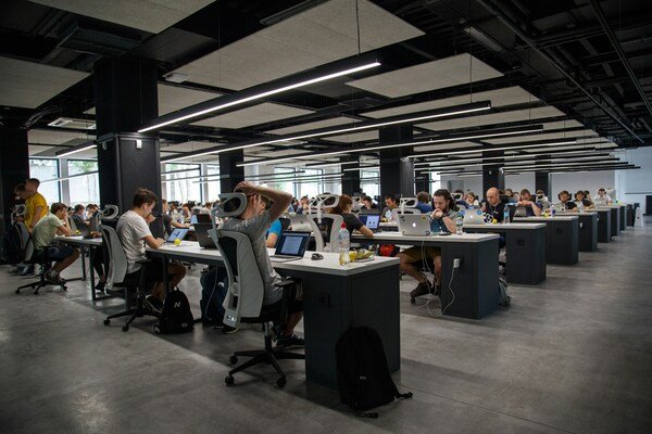 A photo of a crowd doing office work
