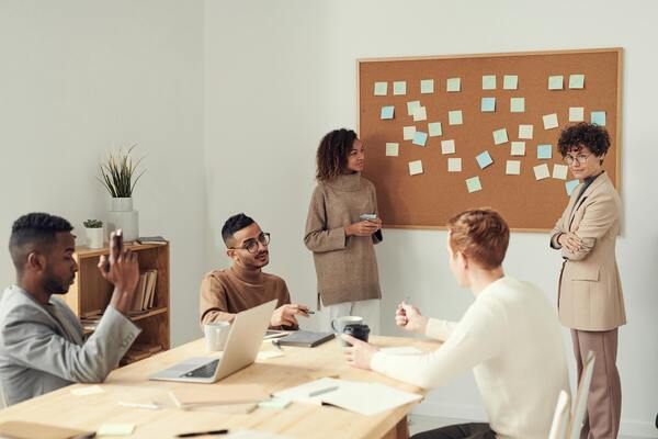 A photo of a group of people having a meeting