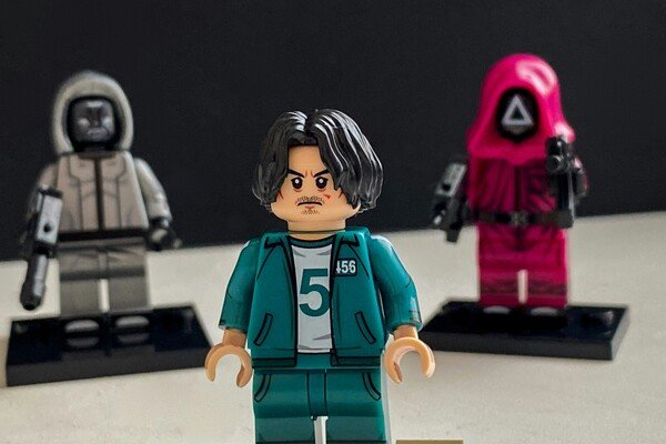 A photo of kids lego toys portraying the squid game characters