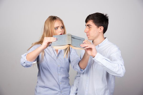 Couple disagreeing over money while questioning splitting bills 50/50 with partner.