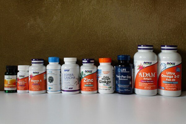 A photo of different types of medicine bottles lined in a row
