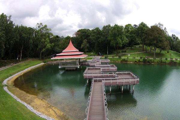 Scenic boardwalk and lakeside pavilion at Lower Seletar Reservoir Park, one of the relaxing outdoor activities in Singapore.