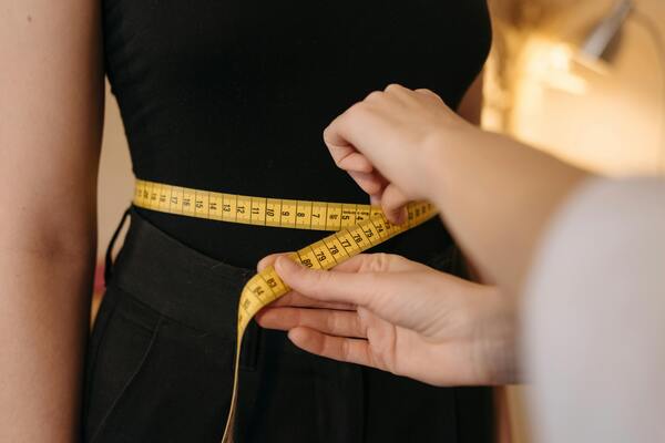 Person using a measuring tape