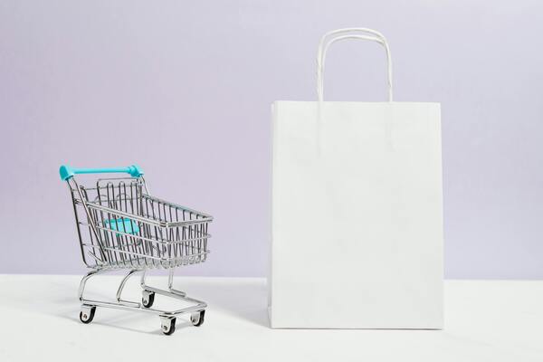 Push cart and a white paper bag