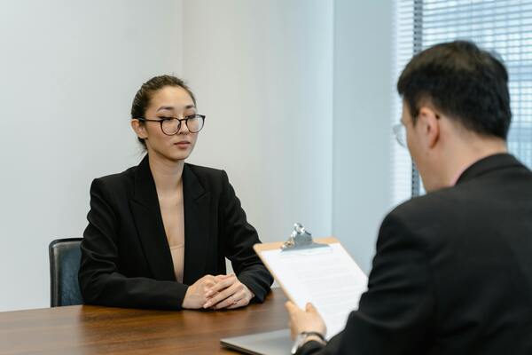 A photo of two people facing each other while having a conversation