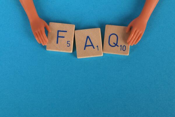 Close-up of Scrabble tiles on a blue surface