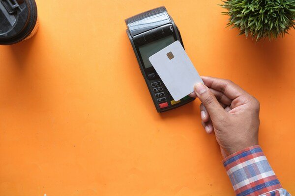 Person holding black and white electronic device