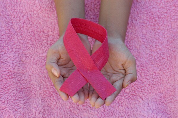 Person with a pink band on her hands
