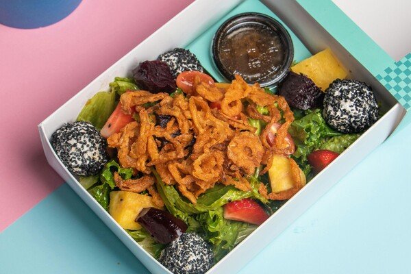 Salad box with a fruit and drink