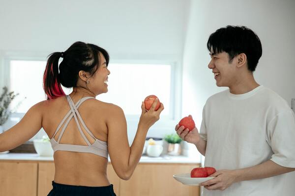 Couple holding apples