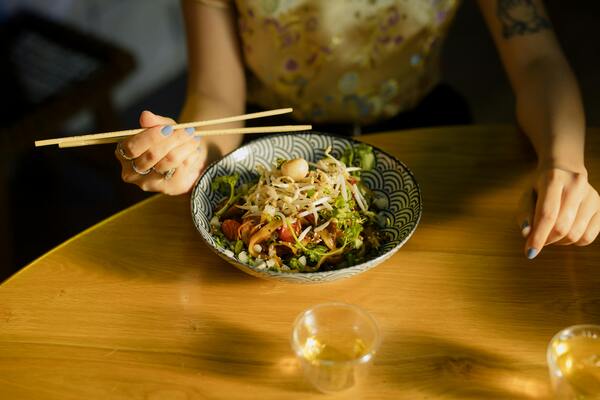 Person eating noodles