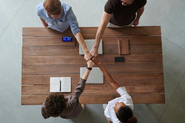 People doing a fist bump