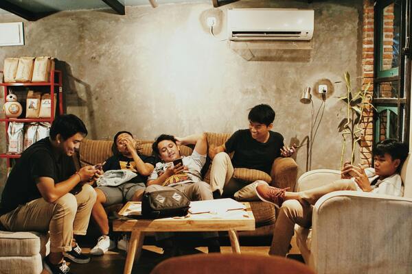 Group of people sitting on a sofa
