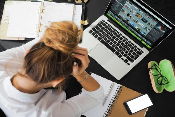Woman sitting in front of a laptop