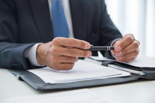 A person holding a pen