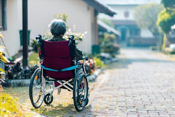 Elderly woman sitting on a wheelchair