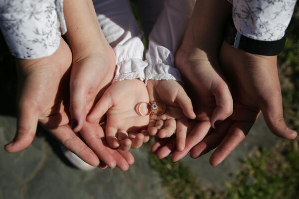 Hands of a family grouped together