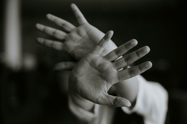 Person stretching their hands towards front