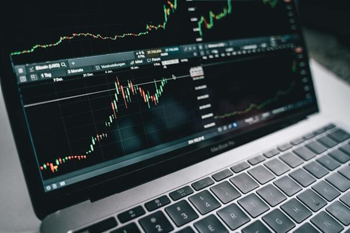 Laptop displaying investment charts and market trends, showing the tools a financial advisor may use to guide investment decisions.