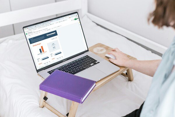 A person trying to search something on the web using a laptop
