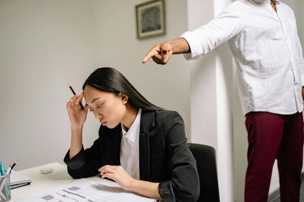 A person working getting scolded
