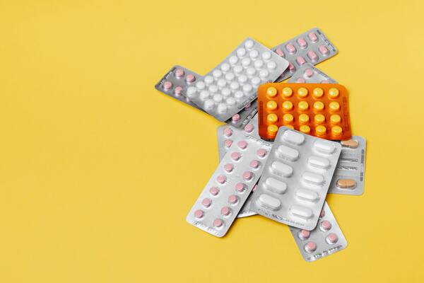 Medicines placed on a yellow table