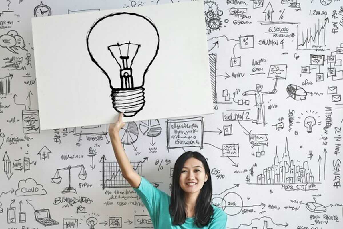 Woman holding a lightbulb illustration symbolising smart tax planning before the SRS and tax deadline in Singapore.