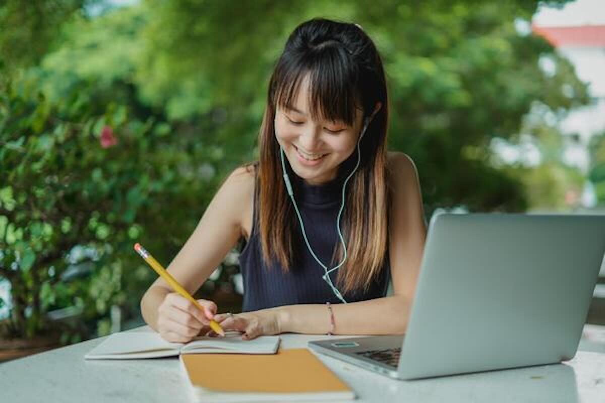 Woman using an online financial calculator while budgeting and planning personal finances.