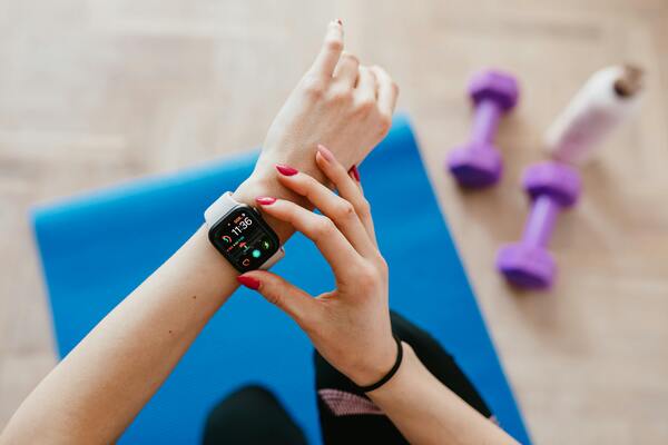 Sportswoman checking on smartwatch