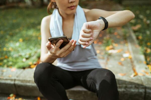 Woman using smartwatch to check on her pulse